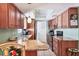 Well-lit kitchen with granite countertops, stylish cabinets, and modern appliances at 4008 Cape Vista Dr, Bradenton, FL 34209