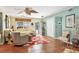 Bright living room featuring natural light, neutral color palette, and comfortable seating arrangement on ceramic tile flooring at 4008 Cape Vista Dr, Bradenton, FL 34209