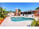 Backyard pool features well-maintained landscaping, an outdoor seating area, and a screened-in porch at 4008 Cape Vista Dr, Bradenton, FL 34209