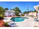 Beautiful backyard featuring a refreshing pool, patio, landscaped yard, privacy fence, and shed at 4008 Cape Vista Dr, Bradenton, FL 34209