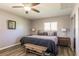 This bedroom features wood floors, neutral paint, and a ceiling fan at 4123 Rock Creek Dr, Port Charlotte, FL 33948
