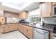 Modern kitchen with updated appliances, granite countertops, and a convenient breakfast bar at 4123 Rock Creek Dr, Port Charlotte, FL 33948