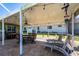 Covered patio with dining and lounge furniture perfect for outdoor entertaining at 4123 Rock Creek Dr, Port Charlotte, FL 33948