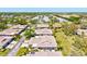 Overhead view showcases the neighborhood with green lawns and manicured landscaping enhancing curb appeal at 4451 Atwood Cay Cir # 7, Sarasota, FL 34233