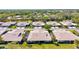 Birds-eye showcases the neighborhood's lush greenery, manicured lawns, and mature trees, offering a serene environment at 4451 Atwood Cay Cir # 7, Sarasota, FL 34233