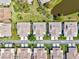 Overhead shot showing green lawns and lush landscaping, with a tranquil lake enhancing the neighborhood's charm at 4451 Atwood Cay Cir # 7, Sarasota, FL 34233