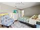 Bedroom with a soft rug, comfy armchair, and neutral paint at 4451 Atwood Cay Cir # 7, Sarasota, FL 34233