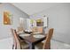 Charming dining space featuring stylish wicker chairs and an open view to the breakfast bar enhancing a communal atmosphere at 4451 Atwood Cay Cir # 7, Sarasota, FL 34233