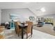 Inviting dining area with vaulted ceilings and skylight flowing into a sunroom and living room, perfect for entertaining at 4451 Atwood Cay Cir # 7, Sarasota, FL 34233