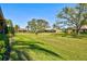 Green lawn and lush landscaping surrounding the condos at 4451 Atwood Cay Cir # 7, Sarasota, FL 34233