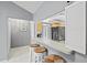 Kitchen bar with counter seating, white cabinets, and modern fixtures at 4451 Atwood Cay Cir # 7, Sarasota, FL 34233