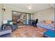 Tile lanai with comfortable seating and view to the living room at 4451 Atwood Cay Cir # 7, Sarasota, FL 34233