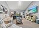 Bright living room with plush seating, tv, and sliding glass doors at 4451 Atwood Cay Cir # 7, Sarasota, FL 34233