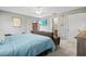 Bright main bedroom featuring a flat-screen television and ensuite bathroom at 4451 Atwood Cay Cir # 7, Sarasota, FL 34233