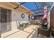 Enclosed patio with comfortable seating, an outdoor TV, and charming accents at 4451 Atwood Cay Cir # 7, Sarasota, FL 34233