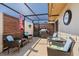 Covered patio area offers relaxing seating, a grill, and a fire pit table at 4451 Atwood Cay Cir # 7, Sarasota, FL 34233
