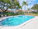 Inviting community pool surrounded by lush landscaping, offering a refreshing retreat for residents in a tranquil setting at 4451 Atwood Cay Cir # 7, Sarasota, FL 34233