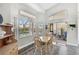 Cozy dining area with natural light, with backyard and pool access at 457 Lake Of The Woods Dr, Venice, FL 34293