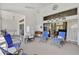 Enclosed patio featuring ample seating, a ceiling fan, and views into the home at 457 Lake Of The Woods Dr, Venice, FL 34293