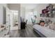 Unique bedroom featuring a hammock chair, desk area, lots of light and view into the connected bathroom at 4606 Lake Fox Pl, Parrish, FL 34219