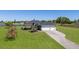 Beautiful home with a sprawling lawn, three car garage, and a serene lake view at 4606 Lake Fox Pl, Parrish, FL 34219