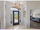 Grand foyer with tiled floors and views into the dining and living rooms at 4606 Lake Fox Pl, Parrish, FL 34219