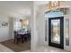 Welcoming foyer that flows into the dining room with decorative lighting at 4606 Lake Fox Pl, Parrish, FL 34219