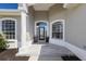 Inviting front entrance with decorative windows and a stylish front door at 4606 Lake Fox Pl, Parrish, FL 34219