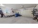 Spacious two car garage with ample room for vehicle parking, boat, mower and storage at 4606 Lake Fox Pl, Parrish, FL 34219