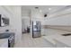 Bright kitchen features stainless appliances and white cabinets with an adjacent dining area at 4606 Lake Fox Pl, Parrish, FL 34219