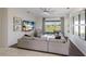 Bright living room with natural light and picturesque views of the serene backyard at 4606 Lake Fox Pl, Parrish, FL 34219