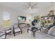 Bright living room features a TV, computer desk, and chairs to entertain at 4606 Lake Fox Pl, Parrish, FL 34219