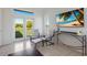 Bright room featuring a TV and comfortable seating, showcasing access to the outside with greenery at 4606 Lake Fox Pl, Parrish, FL 34219