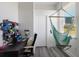 Cozy office space with a comfortable desk, and an inviting hammock chair at 4606 Lake Fox Pl, Parrish, FL 34219