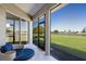 Screened in patio overlooking a lush backyard and a beautiful waterfront view at 4606 Lake Fox Pl, Parrish, FL 34219
