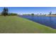 Beautiful pond with a well-maintained grassy bank that stretches as far as the eye can see at 4606 Lake Fox Pl, Parrish, FL 34219
