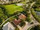 Aerial view of a well maintained house in a community with pool and playground and green spaces at 4706 Cayo Costa Pl, Bradenton, FL 34203