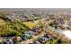 An aerial view of a community with lush landscaping, a pool, and various recreational amenities at 4706 Cayo Costa Pl, Bradenton, FL 34203