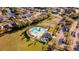 Aerial view of community pool and basketball court with ample parking in a well-maintained neighborhood at 4706 Cayo Costa Pl, Bradenton, FL 34203