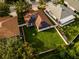 Aerial view of a home with solar panels, an expansive backyard, and surrounding neighborhood at 4706 Cayo Costa Pl, Bradenton, FL 34203