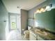 Bathroom with a shower stall, toilet, and vanity at 4706 Cayo Costa Pl, Bradenton, FL 34203