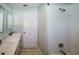 Bathroom with a walk-in shower and dual sinks at 4706 Cayo Costa Pl, Bradenton, FL 34203