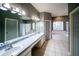 Primary bathroom featuring double sinks, a soaking tub, and a walk-in shower at 4706 Cayo Costa Pl, Bradenton, FL 34203