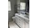 Modern bathroom featuring a double sink vanity with white cabinets and countertop space at 4706 Cayo Costa Pl, Bradenton, FL 34203