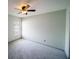 Bedroom featuring neutral gray carpet and a ceiling fan at 4706 Cayo Costa Pl, Bradenton, FL 34203