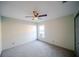 Spare bedroom featuring carpeting, a ceiling fan, and a bright window at 4706 Cayo Costa Pl, Bradenton, FL 34203