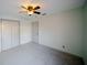 Clean bedroom features neutral walls, standard closet with bi-fold doors, and carpet flooring at 4706 Cayo Costa Pl, Bradenton, FL 34203
