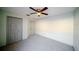 Spare bedroom featuring carpeting, a ceiling fan, and a double closet at 4706 Cayo Costa Pl, Bradenton, FL 34203
