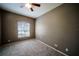 Cozy bedroom featuring carpet, a window, and ceiling fan for a relaxing ambiance at 4706 Cayo Costa Pl, Bradenton, FL 34203