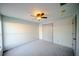 This bedroom features neutral walls, carpet, and a double door closet at 4706 Cayo Costa Pl, Bradenton, FL 34203